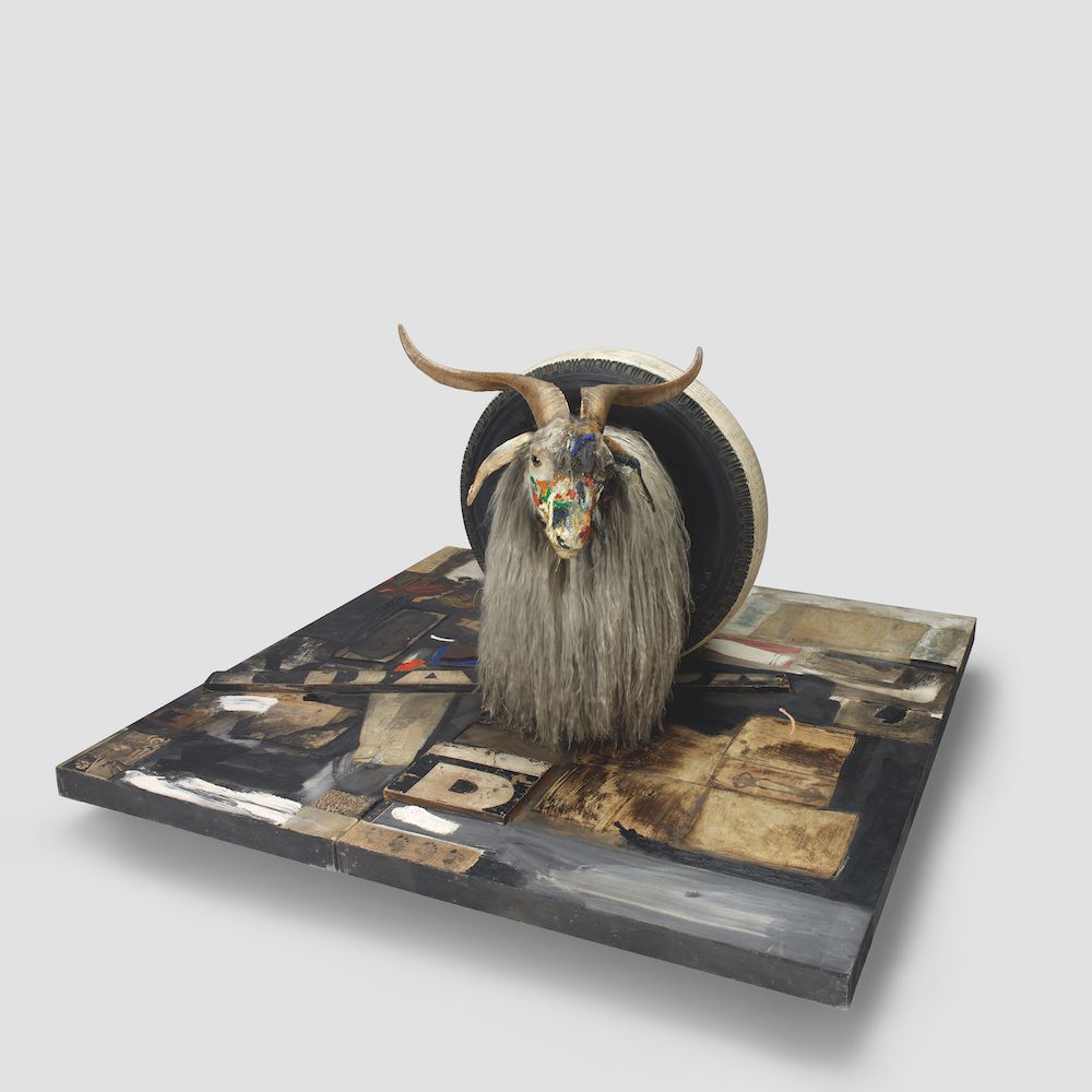 Robert Rauschenberg. Monogram. 1955–59. Oil, paper, fabric, printed reproductions, metal, wood, rubber shoe-heel, and tennis ball on two conjoined canvases with oil on taxidermied Angora goat with brass plaque and rubber tire on wood platform mounted on four casters, 42 × 53 1/4 × 64 1/2 in. (106.7 × 135.2 × 163.8 cm). Moderna Museet, Stockholm. Purchase with contribution from Moderna Museets Vänner/The Friends of Moderna Museet. © 2017 Robert Rauschenberg Foundation<br/>